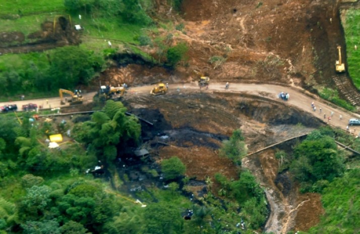 A photo released by Petroecuador shows a 420,000-gallon oil spill in Ecuador's Amazonian region in June 2013. (AP Photo/Petroecuador)