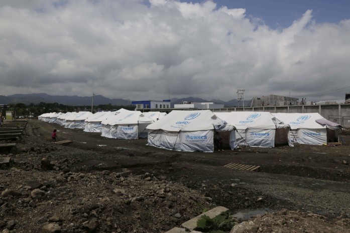 In this May 15, 2016 photo, tents set up for people displaced by last month’s earthquake stand in rows at the new bus terminal in Pedernales, Ecuador. A month after the magnitude 7.8 earthquake many Ecuadorians are still struggling. (Dolores Ochoa/Associated Press)