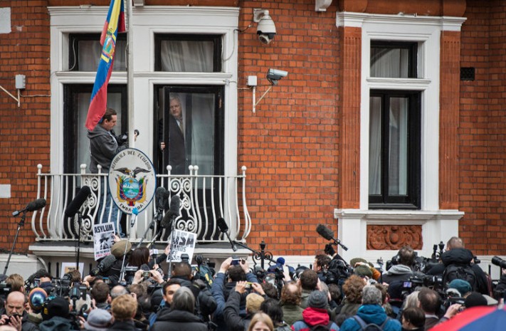 Julian Assange, founder of Wikileaks, emerging onto the balcony of the Ecuadorean Embassy in London to make a statement in February. Credit Chris Ratcliffe/Getty Images