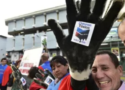 Activists protest against US multinational energy corporation Chevron at a square in Quito RODRIGO BUENDIA/Getty Images