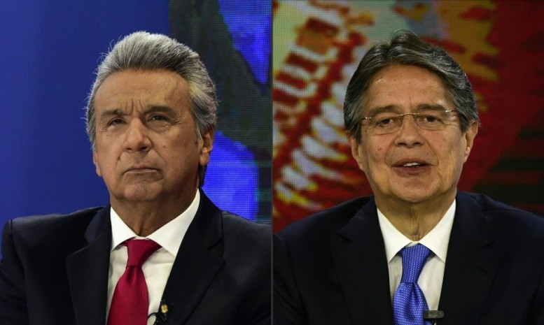 Lenin Moreno, left, the Ecuadoran ruling party's presidential candidate, is trailing right-wing challenger Guillermo Lasso in the latest polls, ahead of a runoff in April. Lasso has vowed to end the diplomatic protection that President Rafael Correa has extended to WikiLeaks founder Julian Assange since 2012, which would force him from the country's embassy in London. (Rodrigo Buendia/AFP/Getty Images) Lenin Moreno, left, the Ecuadoran ruling party's presidential candidate, is trailing right-wing challenger Guillermo Lasso in the latest polls, ahead of a runoff in April. Lasso has vowed to end the diplomatic protection that President Rafael Correa has extended to WikiLeaks founder Julian Assange since 2012, which would force him from the country's embassy in London. (Rodrigo Buendia/AFP/Getty Images)